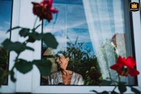 Beautiful bride getting ready for her big day at her parents' home in Bourgogne-Franche-Comte.